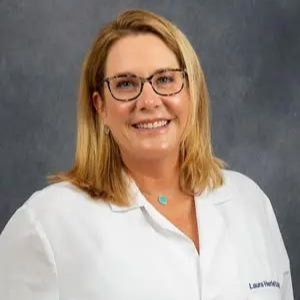 Laura Herfel, smiling after performing a teeth whitening procedure at the Dental Center of Florence