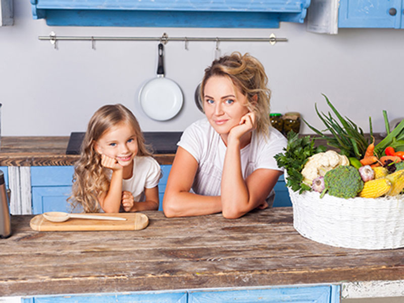 mother and her daughter smiiling